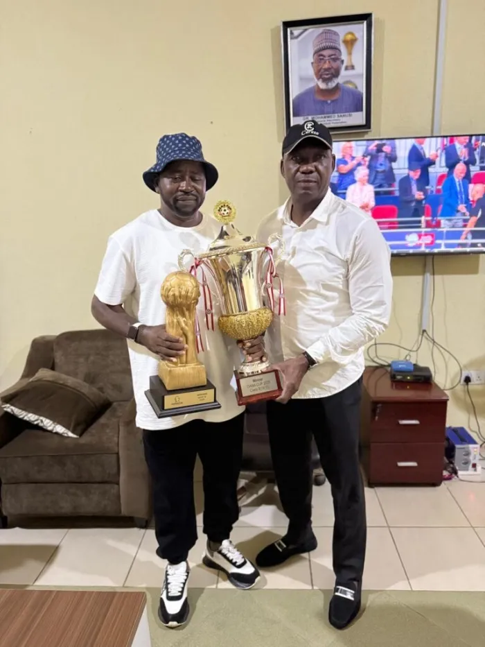 Sporting Supreme FC Presents Gothia and Dana Cup Trophies to NFF Technical Director Austin Eguavoen