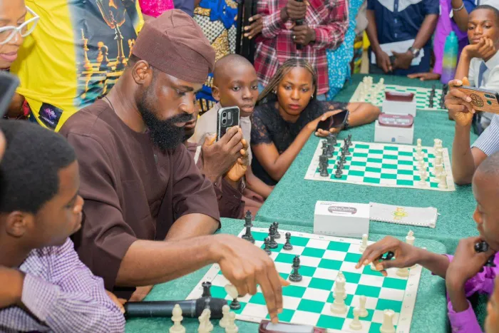 Obasa lights up literacy program in Agege LG with chess icon Onakoya.