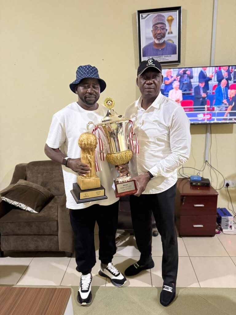 Sporting Supreme FC Presents Gothia and Dana Cup Trophies to NFF Technical Director Austin Eguavoen